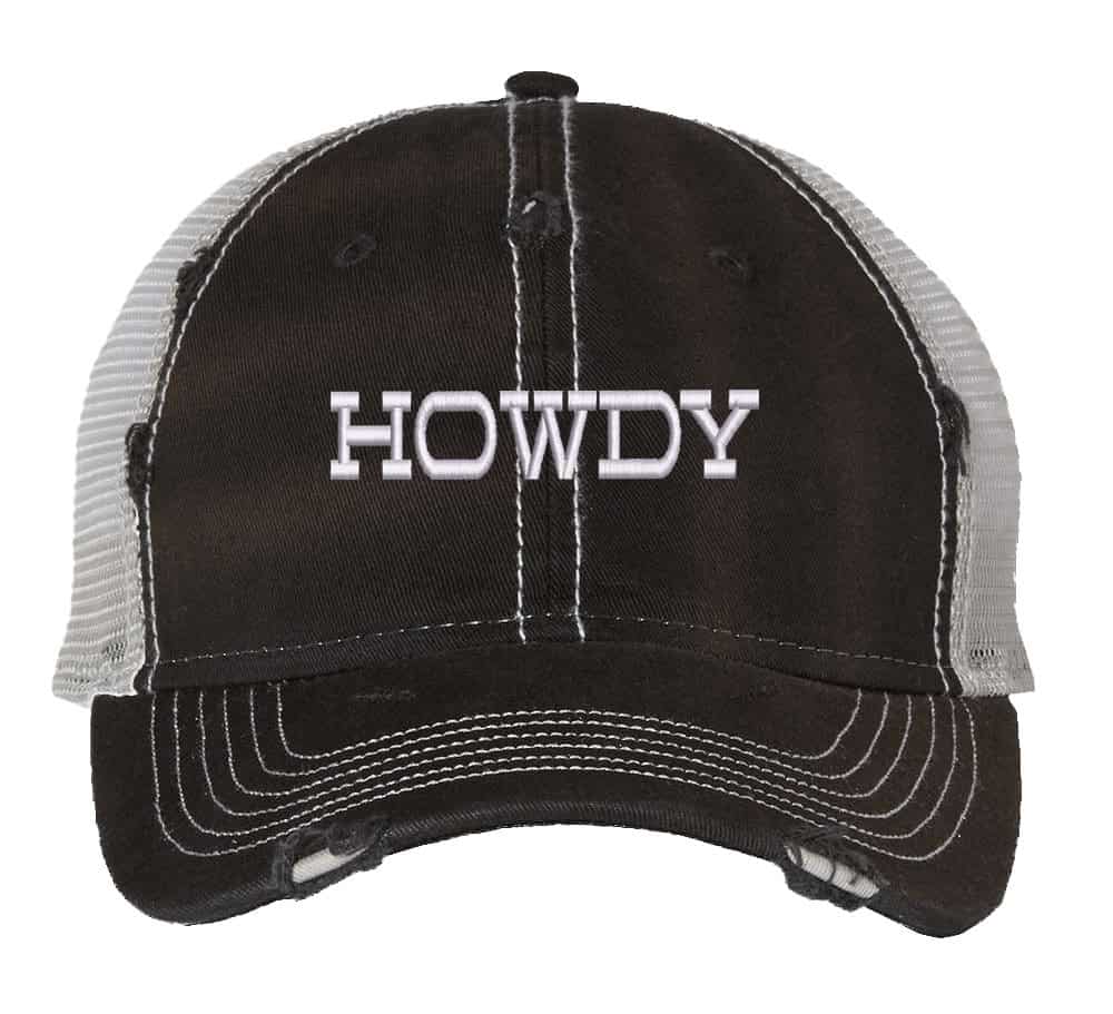 Howdy Distressed Trucker Hat, Urban Country Fashion Hat, Country Mash Trucker Snapback Hat 6 Image shows a distressed trucker hat with the word "Howdy" embroidered on the front. The hat features a mesh back and snapback closure.
