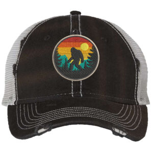 Distressed Bigfoot trucker hat with embroidered Sasquatch patch and mesh back panel for outdoor adventures