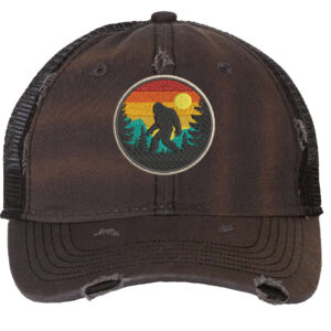 Distressed Bigfoot trucker hat with embroidered Sasquatch patch and mesh back panel for outdoor adventures