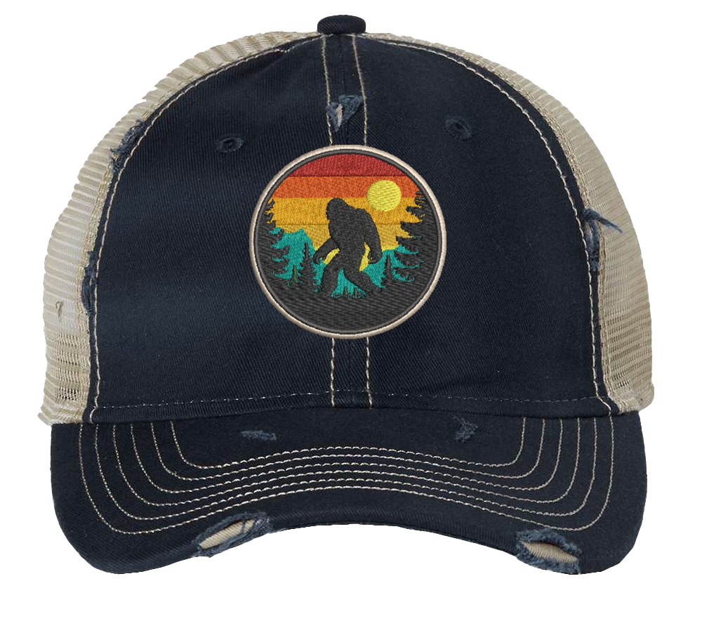 Distressed Bigfoot trucker hat with embroidered Sasquatch patch and mesh back panel for outdoor adventures