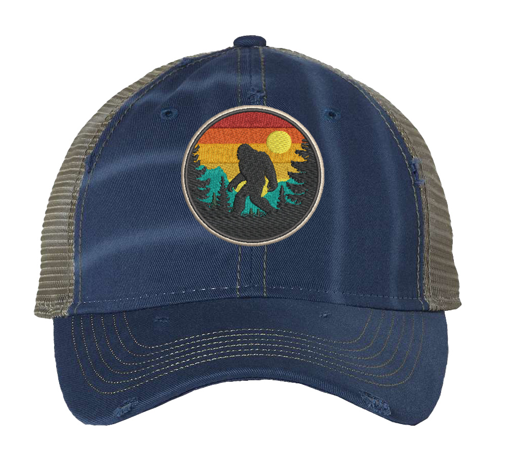 Distressed Bigfoot trucker hat with embroidered Sasquatch patch and mesh back panel for outdoor adventures